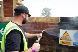 wall being steamed cleaned